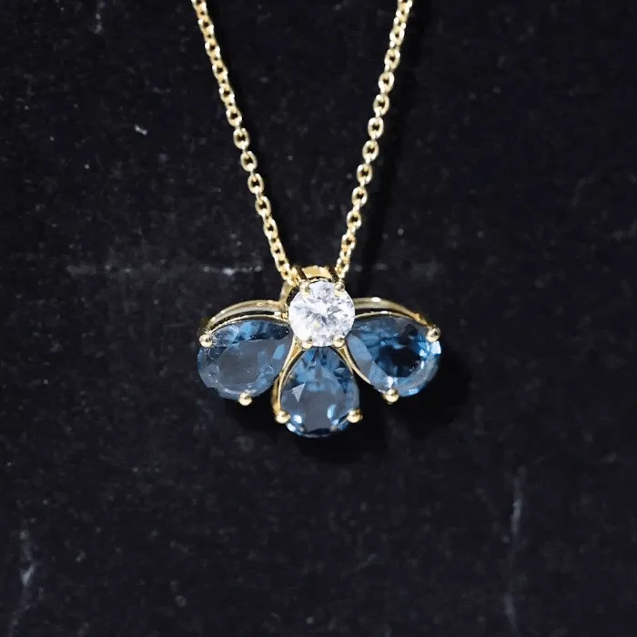 Pear Cut London Blue Topaz and Moissanite Flower Pendant