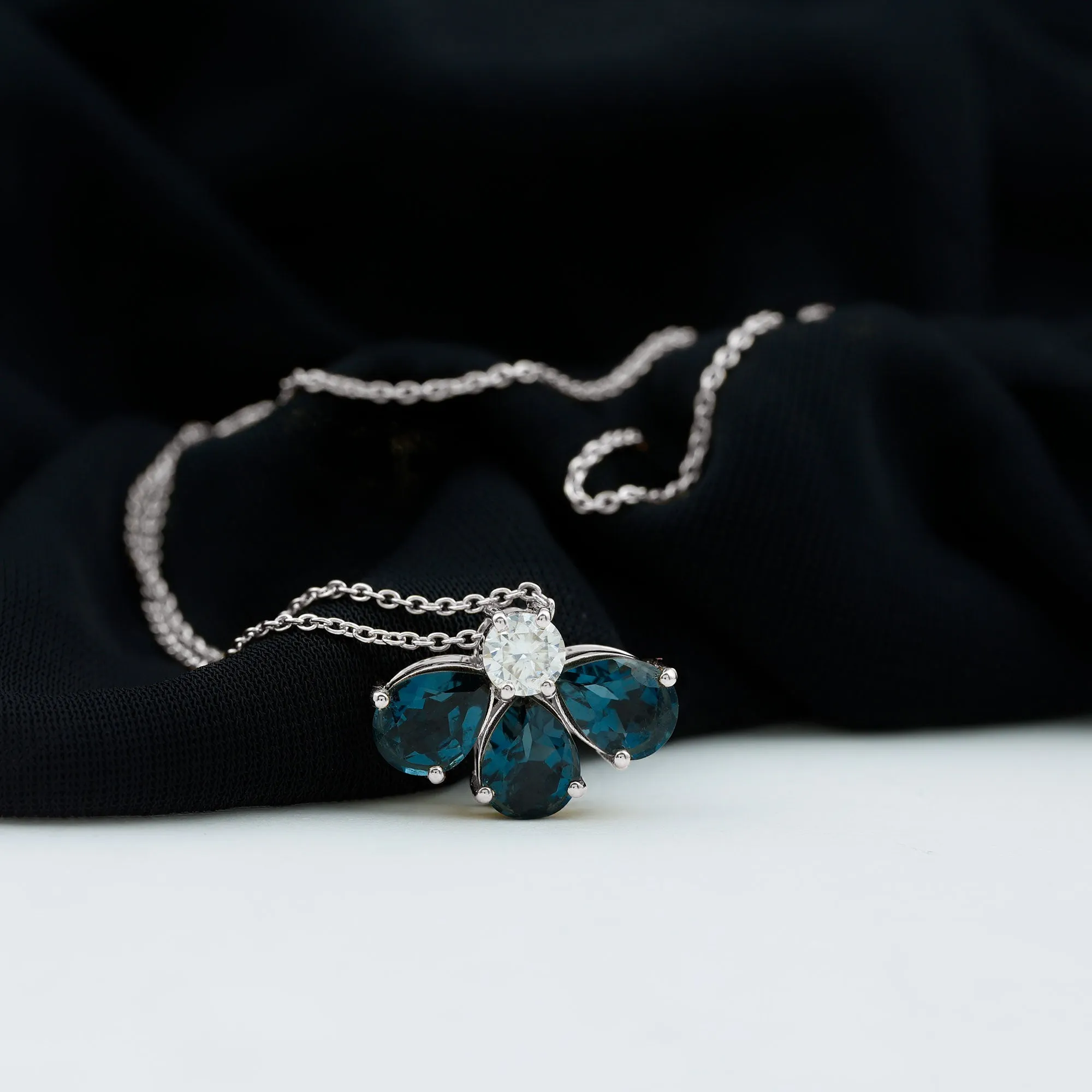 Pear Cut London Blue Topaz and Moissanite Flower Pendant