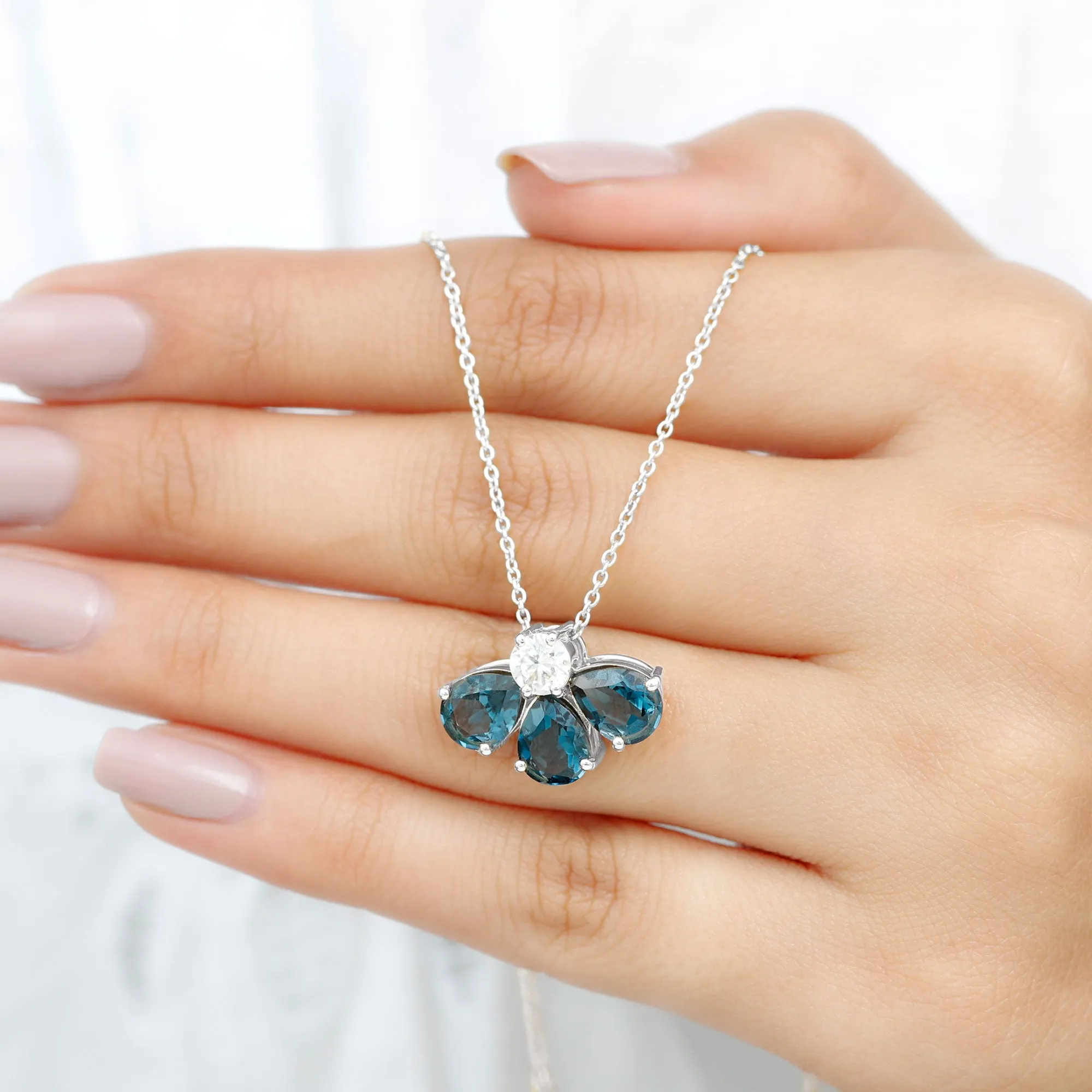 Pear Cut London Blue Topaz and Moissanite Flower Pendant